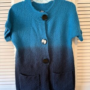 Kenzie pretty sweater with varied colors, big buttons, and two large pockets.